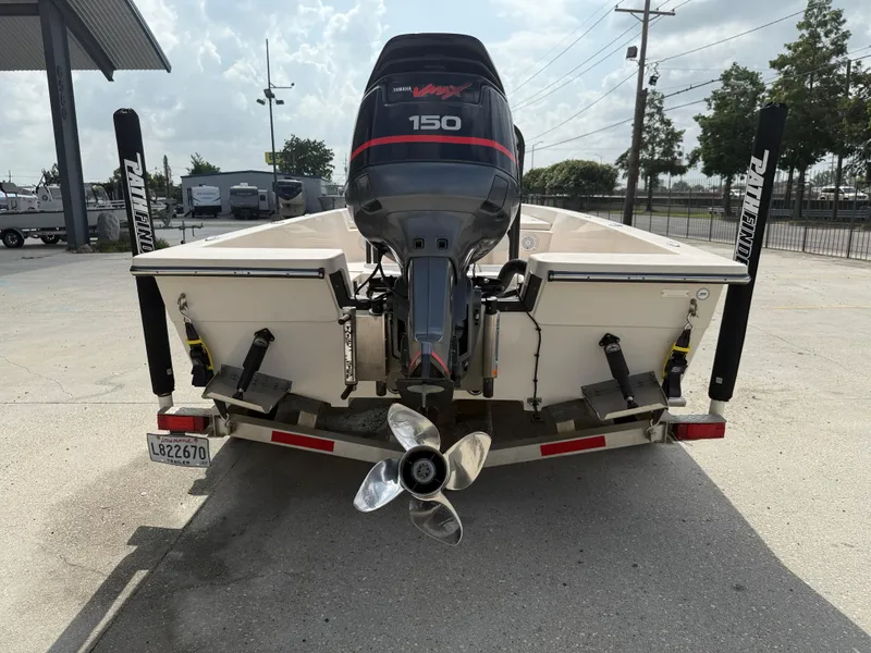 Slide: The Image of 2006 Pathfinder 2200v boat with Yamaha 150 outboard motor, parked on a trailer. - 6