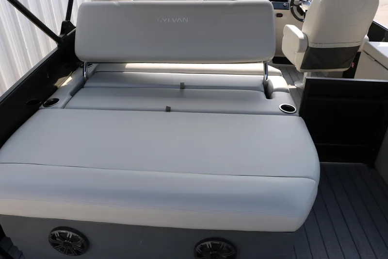 Slide: The Image of 2026 Sylvan Mirage Cruise 8520 CLZ DH boat interior with gray seating and cup holders. - 15