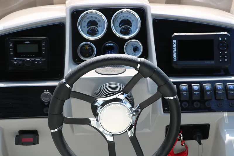Slide: The Image of Steering console of 2026 Sylvan Mirage Cruise 8520 CLZ DH with gauges and controls. - 21