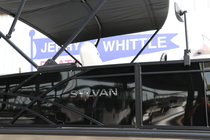Slide: The Image of 2026 Sylvan Mirage Cruise 8520 CLZ DH pontoon boat with canopy, displayed at dealership. - 27