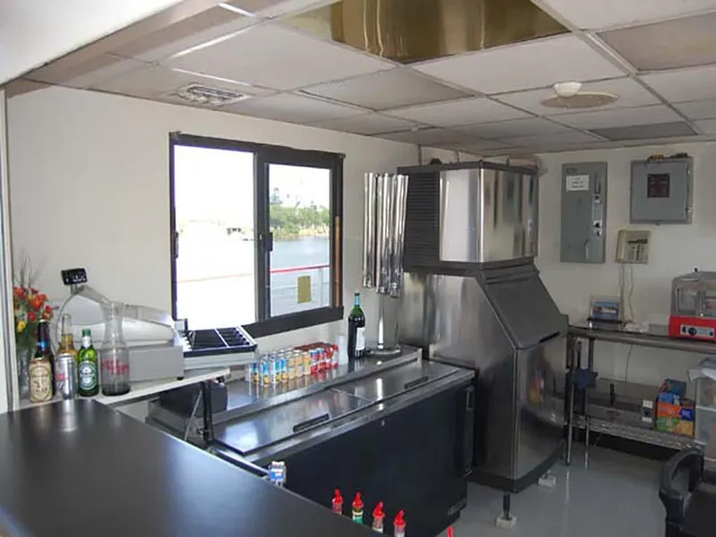 Slide: The Image of Interior of 1985 Custom Serodino Dinner Boat kitchen with bar and appliances. - 27