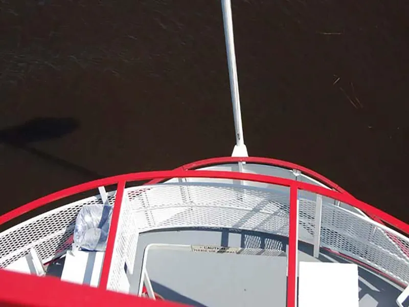 Slide: The Image of Top view of 1985 Custom Serodino Dinner Boat with red railing on water. - 5