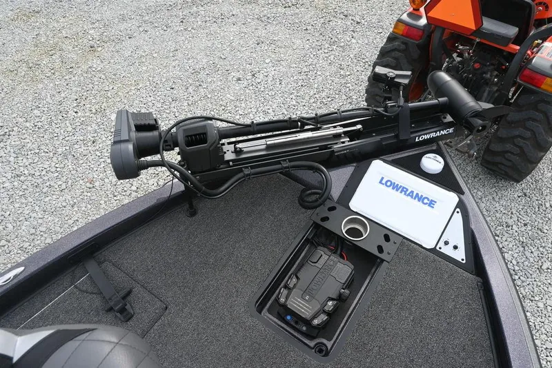 Slide: The Image of 2025 Caymas CX 19 boat with Lowrance equipment and a tractor in the background. - 10