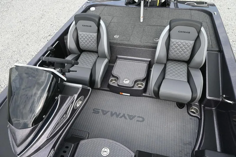 Slide: The Image of 2025 Caymas CX 19 boat interior with dual seats and sleek dashboard design. - 11
