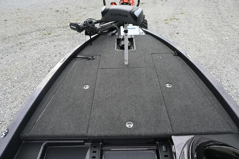 Slide: The Image of 2025 Caymas CX 19 boat deck with carpeted surface and trolling motor. - 12