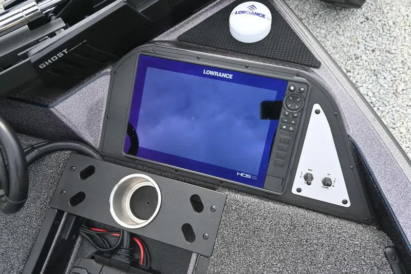 Slide: The Image of 2025 Caymas CX 19 boat dashboard featuring Lowrance HDS display and controls. - 13