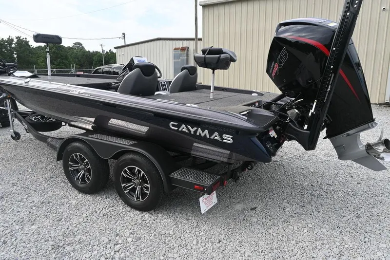 Slide: The Image of 2025 Caymas CX 19 boat on trailer, featuring sleek design and powerful engine. - 2