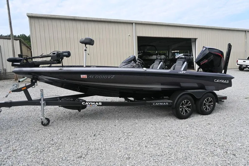 Slide: The Image of 2025 Caymas CX 19 boat on trailer, parked on gravel, with visible motor and equipment. - 3