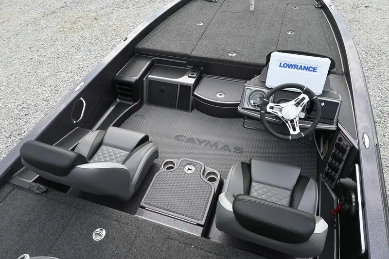 Slide: The Image of 2025 Caymas CX 19 boat interior with dual seats and Lowrance navigation system. - 6