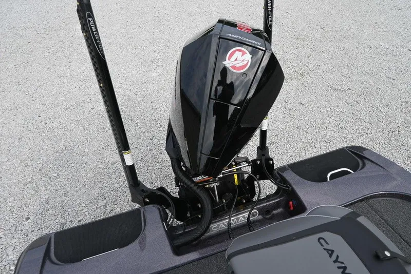 Slide: The Image of 2025 Caymas CX 19 boat with Mercury engine and Power-Pole anchors on gravel surface. - 7
