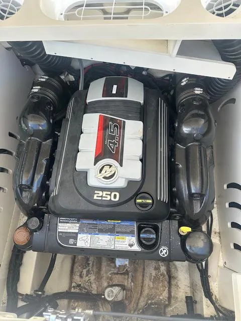 Slide: The Image of 2018 Sea Ray SPX 230 engine compartment with 4.5L 250 horsepower engine. - 14