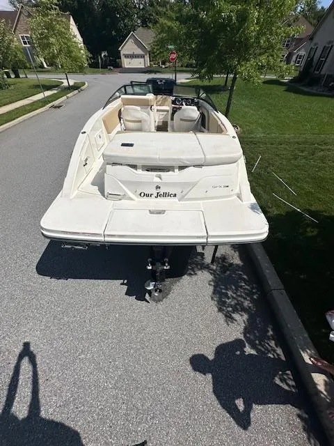 Slide: The Image of 2018 Sea Ray SPX 230 boat parked on a suburban street. - 4