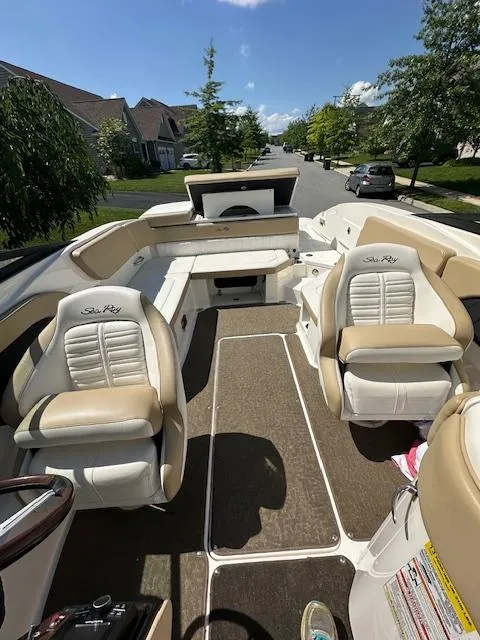 Slide: The Image of 2018 Sea Ray SPX 230 boat interior with beige seating and open deck. - 7