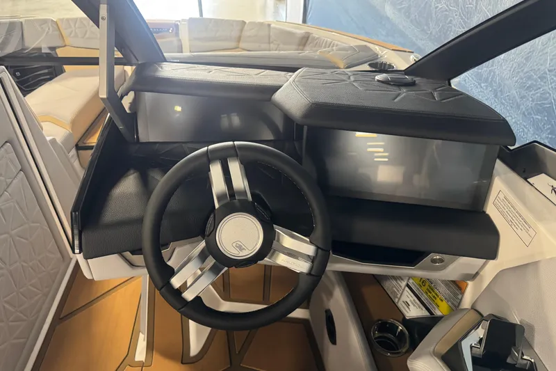 Slide: The Image of 2026 Nautique Super Air Nautique G23 Paragon dashboard with sleek steering wheel and modern controls. - 11