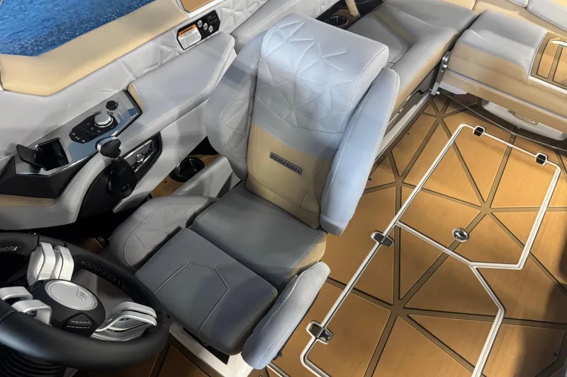 Slide: The Image of 2026 Nautique Super Air Nautique G23 Paragon interior with luxury seating and modern controls. - 12