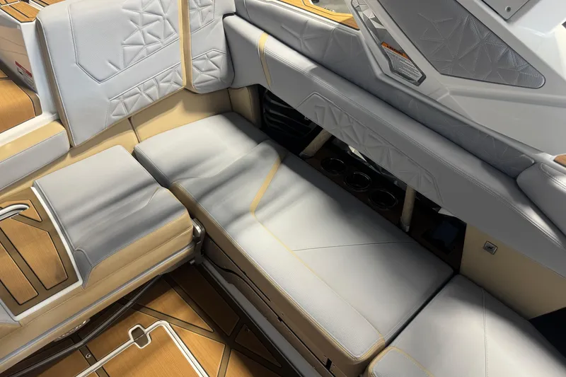 Slide: The Image of 2026 Nautique Super Air Nautique G23 Paragon interior with luxurious seating and cup holders. - 9