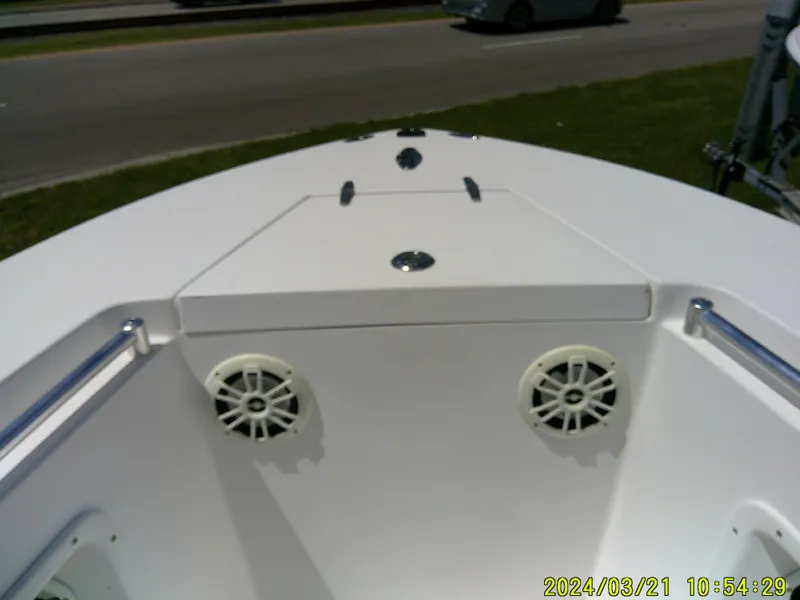 Slide: The Image of 2004 Contender 23 Open boat deck with speakers and storage compartment. - 19