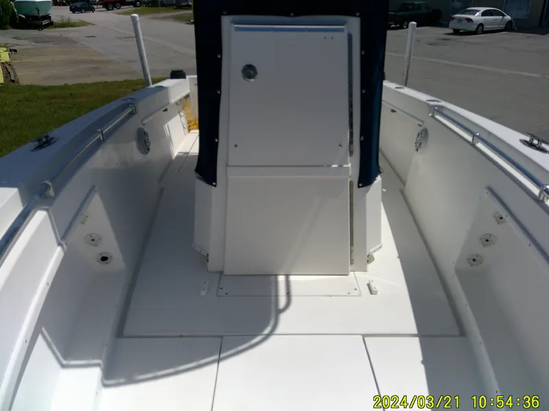 Slide: The Image of 2004 Contender 23 Open boat interior, featuring spacious deck and console. - 22