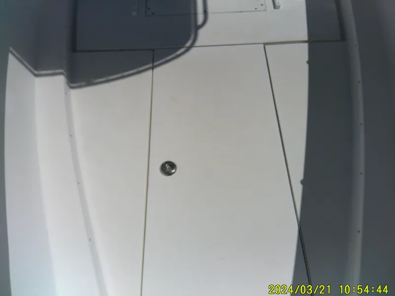 Slide: The Image of 2004 Contender 23 Open boat deck with hatch and shadow. - 25