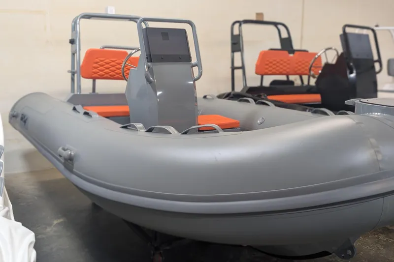 The Image of 2026 Tide Craft Custom Grey and Orange Catalina 13 boat docked with Suzuki outboard motor. - 0