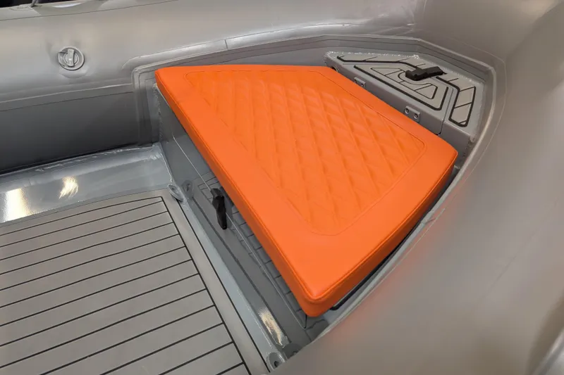 Slide: The Image of 2025 Tide Craft Custom Catalina 13 boat with orange quilted seats and grey interior. - 3