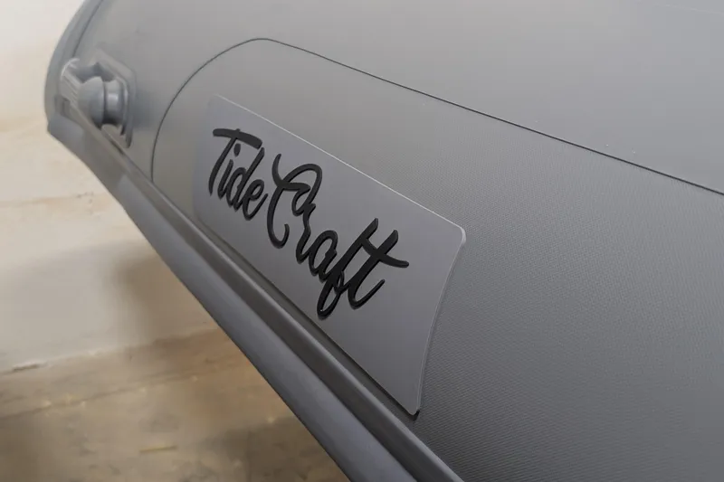 Slide: The Image of 2025 Tide Craft Custom Grey and Orange Catalina 13 boat with orange seats and grey interior. - 5