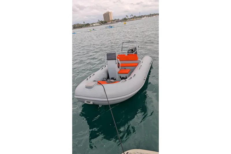 Slide: The Image of 2026 Tide Craft Custom Grey and Orange Catalina 13 boat on water. - 9