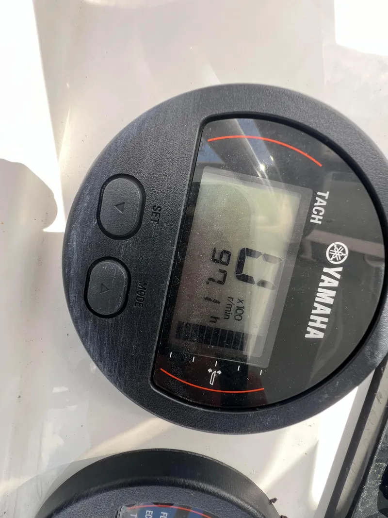 Slide: The Image of Yamaha tachometer display on 2022 Sea Hunt Ultra 229 boat dashboard. - 11