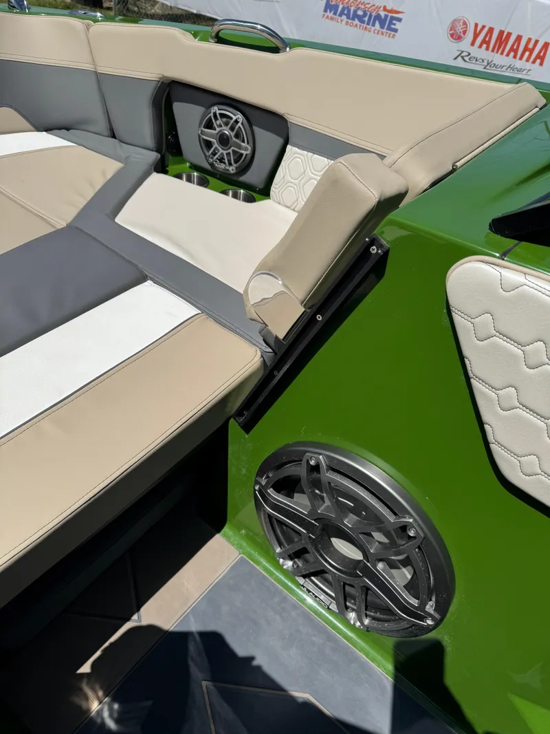 Slide: The Image of 2025 Heyday H22 boat interior with beige seating and speaker system. - 4