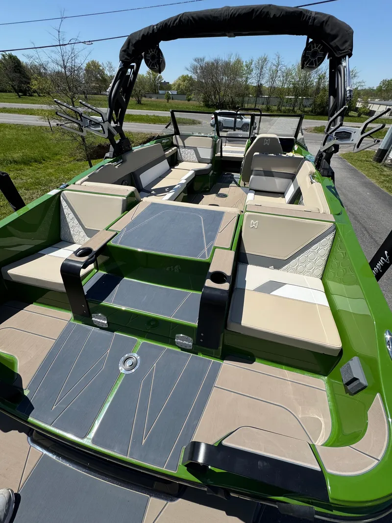 Slide: The Image of 2025 Heyday H22 boat interior with green and beige seating, modern design, and spacious layout. - 8