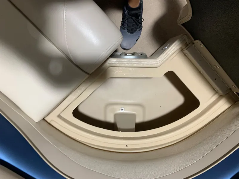 Slide: The Image of Interior of a 2010 Bennington 2250RCW boat showing seating and flooring details. - 16