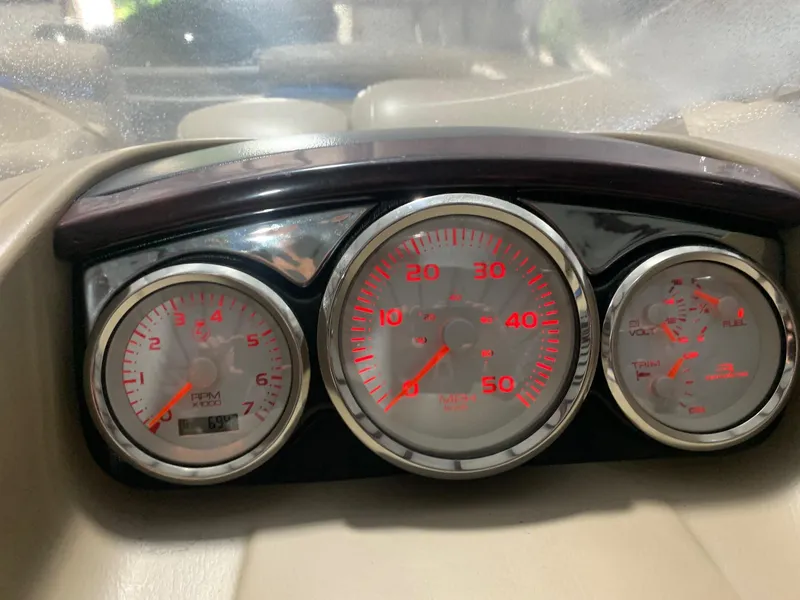 Slide: The Image of Dashboard gauges of a 2010 Bennington 2250RCW boat, displaying RPM, speed, and fuel levels. - 18