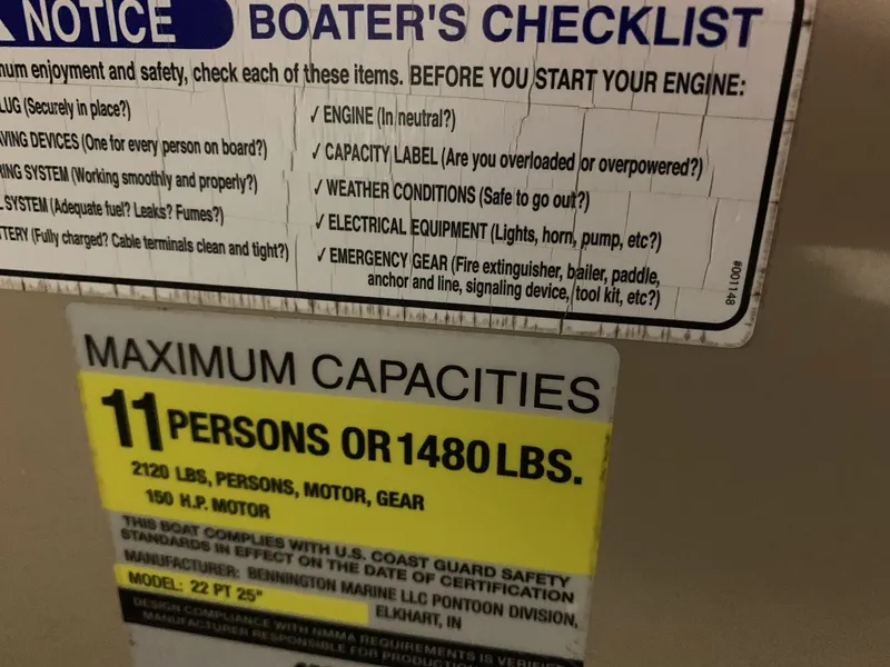 Slide: The Image of Boater's checklist and capacity label for 2010 Bennington 2250RCW, maximum 11 persons or 1480 lbs. - 23
