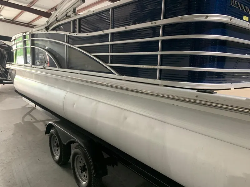 Slide: The Image of 2010 Bennington 2250RCW pontoon boat on trailer in indoor storage. - 5