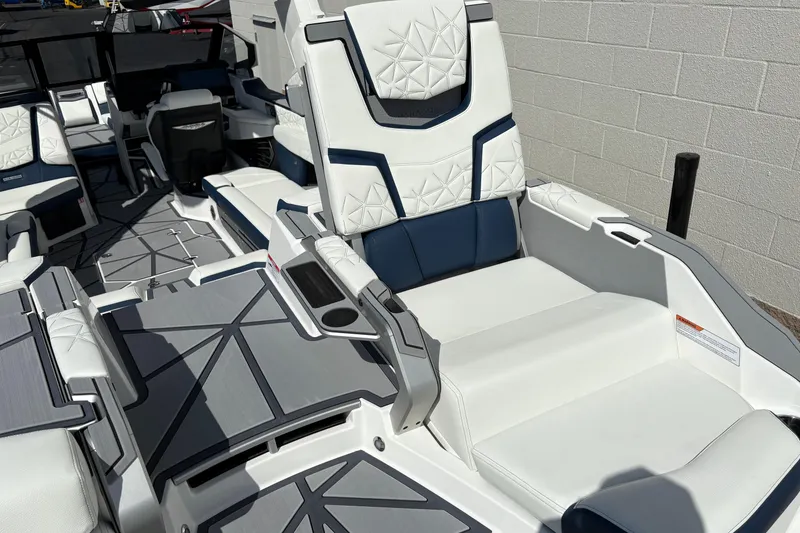 Slide: The Image of 2026 Nautique Super Air Nautique G25 Paragon interior with luxurious white seating. - 5