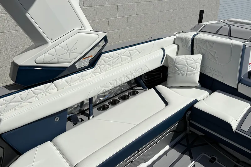 Slide: The Image of Luxurious interior of 2026 Nautique Super Air Nautique G25 Paragon boat with white seating. - 8