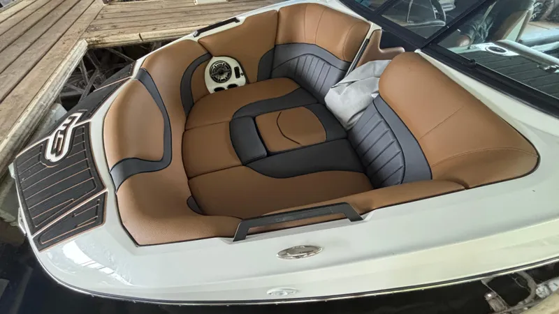Slide: The Image of Luxurious interior of 2025 MB B52 23 Alpha boat with tan and gray seating. - 10