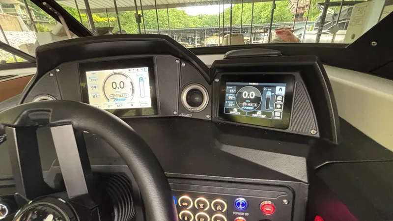Slide: The Image of Dashboard of 2025 MB B52 23 Alpha boat with digital displays and controls. - 12