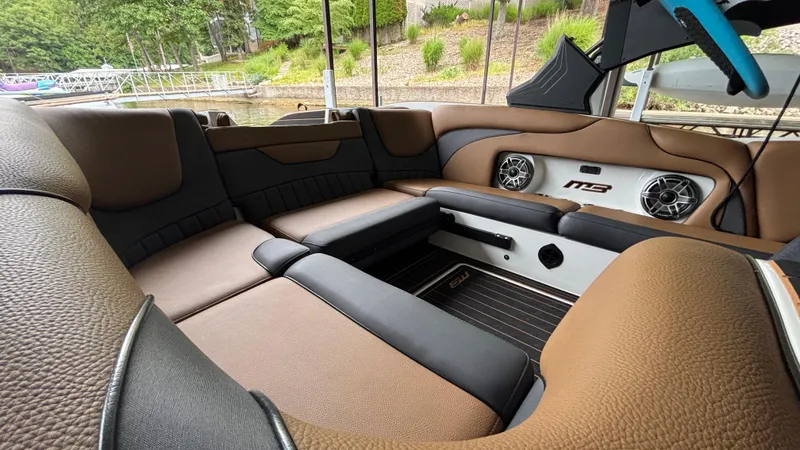 Slide: The Image of Luxurious interior of 2025 MB B52 23 Alpha boat with brown leather seating. - 13