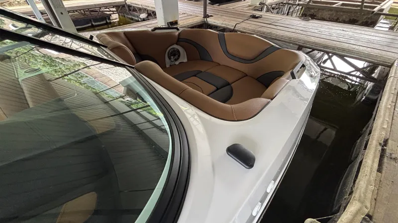 Slide: The Image of 2025 MB B52 23 Alpha boat with tan and black interior in dock. - 14