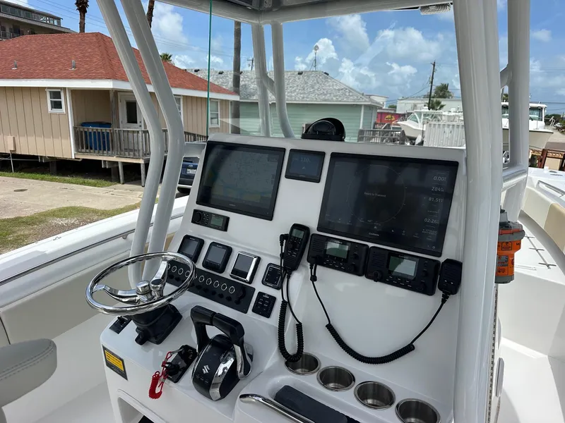 Slide: The Image of 2023 Cape Horn 32xs boat console with advanced navigation and communication equipment. - 4