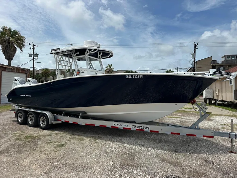 The Image of 2023 Cape Horn 32xs boat on trailer, parked outdoors under a cloudy sky. - 0