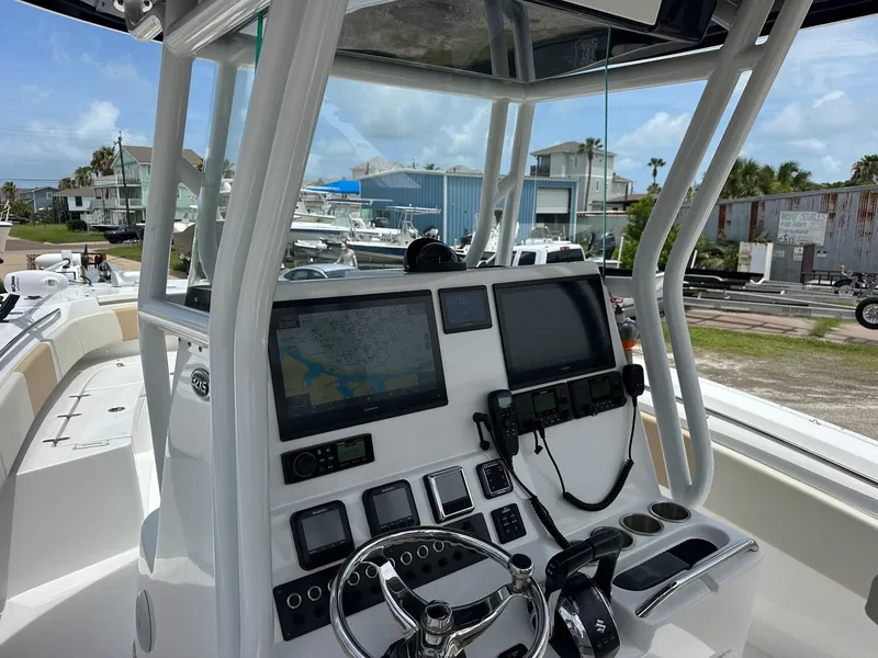 Slide: The Image of 2023 Cape Horn 32xs boat dashboard with navigation screens and controls. - 5
