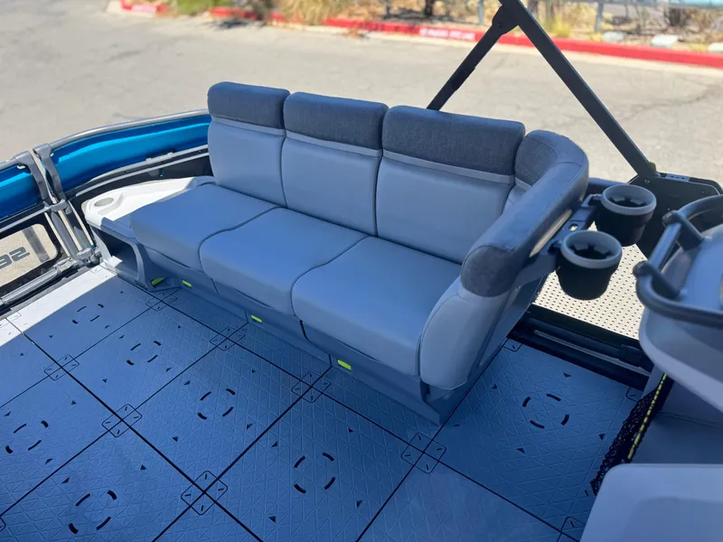 Slide: The Image of 2023 Sea-Doo Switch Cruise 21 interior with comfortable seating and cup holders. - 12