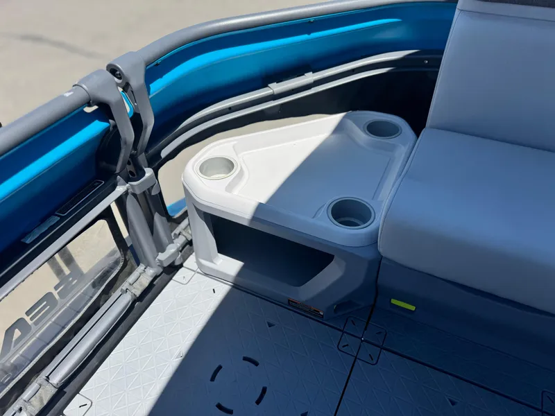 Slide: The Image of 2023 Sea-Doo Switch Cruise 21 interior with cup holders and seating. - 14