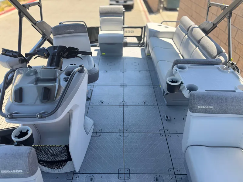 Slide: The Image of 2023 Sea-Doo Switch Cruise 21 interior with spacious seating and modern helm controls. - 15