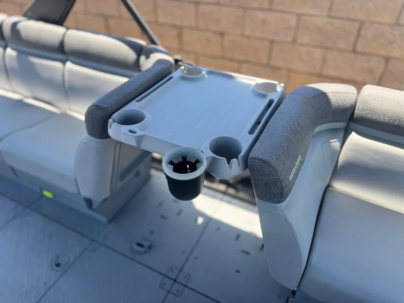 Slide: The Image of 2023 Sea-Doo Switch Cruise 21 interior with seating and cup holders. - 16