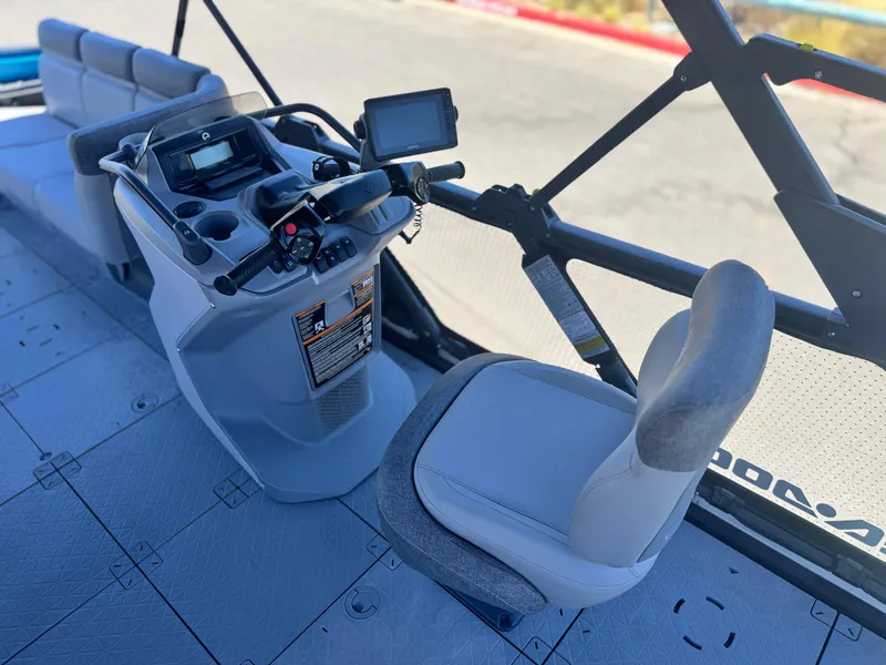 Slide: The Image of 2023 Sea-Doo Switch Cruise 21 cockpit with steering wheel and seating. - 21