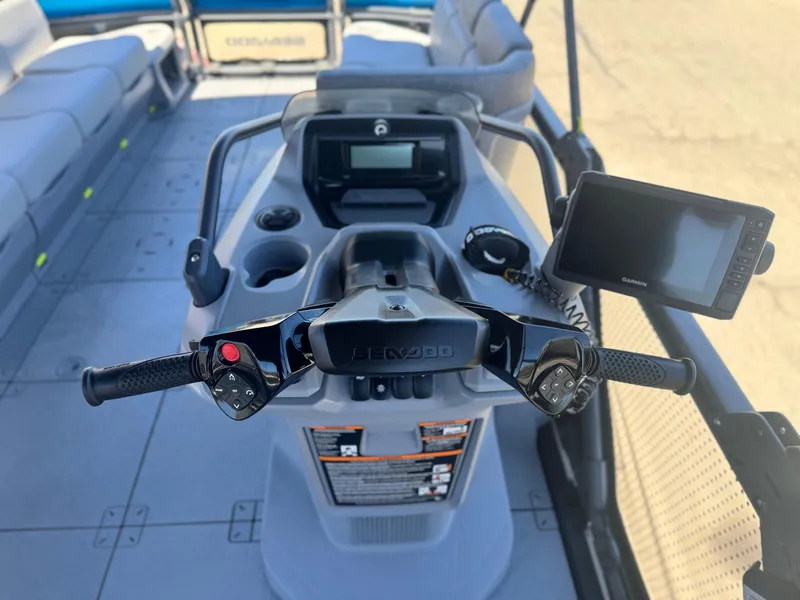 Slide: The Image of 2023 Sea-Doo Switch Cruise 21 dashboard with steering controls and navigation system. - 22