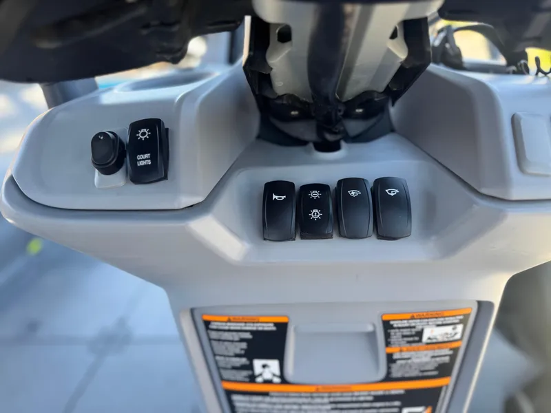 Slide: The Image of Control panel of 2023 Sea-Doo Switch Cruise 21 with various switches and labels. - 24